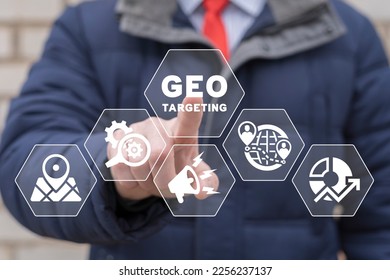 Businessman using virtual touchscreen presses inscription: GEO TARGETING. Geo targeting business marketing concept.
