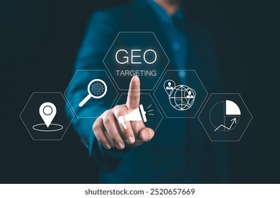 Businessman using virtual touchscreen presses inscription: GEO TARGETING. Geo targeting business marketing concept.