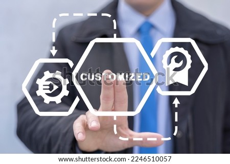 Businessman using virtual touchscreen presses word: CUSTOMIZED. Customization business product concept. User customize settings.