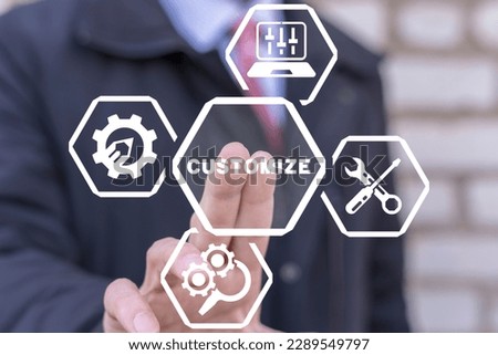 Businessman using virtual touchscreen presses word: CUSTOMIZE. Concept of customization business product. Customized user settings.
