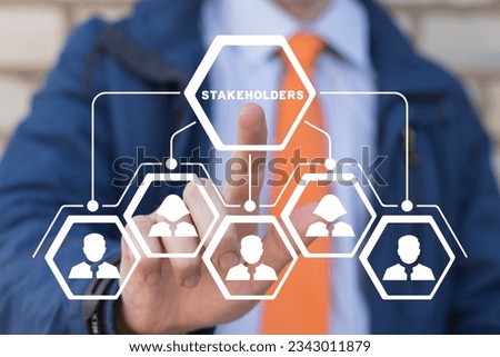 Businessman using virtual touchscreen presses word: STAKEHOLDERS. Concept of business finance stakeholder investment management. Different stakeholders contact collaboration for company organization.