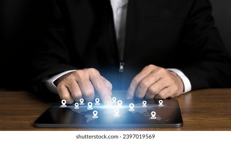 Businessman using virtual world map with location icon and connection line for business technology global network concept.
