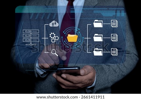 Businessman using visual screen for Documents management information system. documentation in enterprise with ERP. online documentation database and process automation to efficiently manage files 