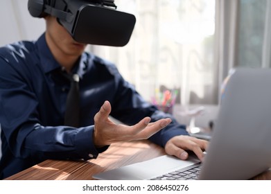 Businessman is using VR glasses to work. Virtual world. - Shutterstock ID 2086450276