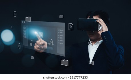 Businessman using VR virtual reality headset gear, working with multimedia software application technology, tools for business production, managing computer files document in augmented reality. - Powered by Shutterstock