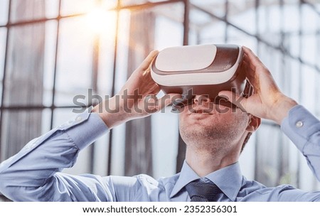 businessman in virtual reality headset in the office