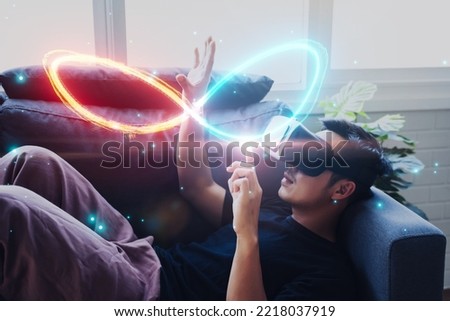 Businessman Virtual reality VR simulation infinity symbol connecting unlimited internet data usage speed, infinite data user storage cloud computing storage cyberspace network, blue background
