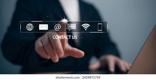 Businessman with virtual screen contact icons email, address, live chat, internet wifi. Contact us or Customer support hotline people connect.Contact us or Customer support hotline people connect. - Powered by Shutterstock