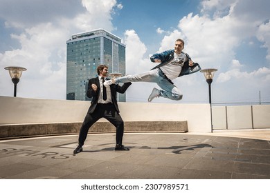 Businessman vs. Professional Martial Arts Fighter in Epic High-Flying Battle on Bangkok Rooftop, Thailand. Behind-the-Scenes Training with High Karate Kick.  - Powered by Shutterstock