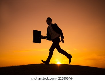 Businessman Walking Across the Hill - Powered by Shutterstock
