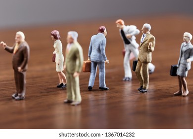 A Businessman Walking Against Crowd.