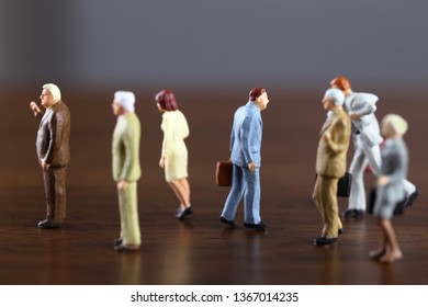 A Businessman Walking Against Crowd.