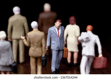 A Businessman Walking Against Crowd.