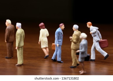 A Businessman Walking Against Crowd.