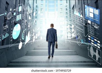 Businessman Walking In Futuristic City With Virtual Screens, Back View