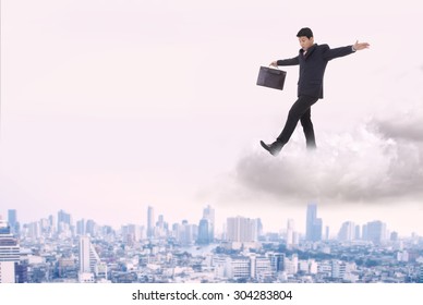 Businessman Walking On A Cloud Near Miss.