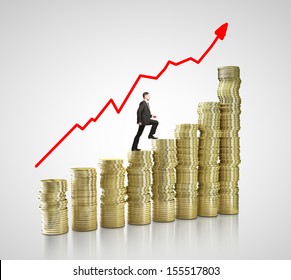 businessman walking on gold coins chart - Shutterstock ID 155517803