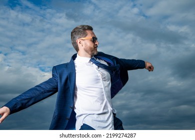 Businessman Walking In Open Suit Jacket Fluttering In Carefree Wind. Carefree Businessman