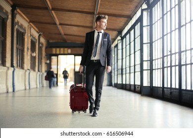 Businessman walking in a station