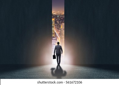 Businessman walking towards his ambition - Shutterstock ID 561672106