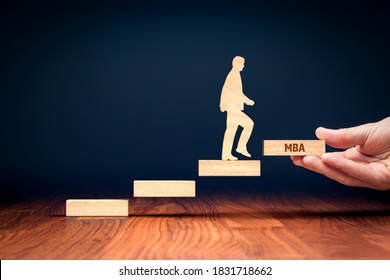 Businessman want to growth and to get MBA education. Hand with the last peace of stairs (symbol of growth) with text MBA and rising person made from wood. - Shutterstock ID 1831718662