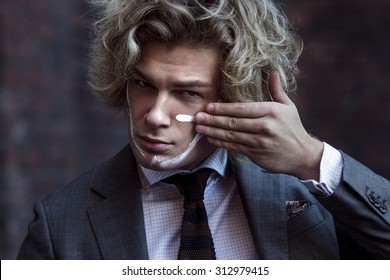 Businessman Warrior. Young Man Makes War Paint On His Face, Concept