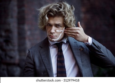 Businessman Warrior. Young Man Makes War Paint On His Face, Concept