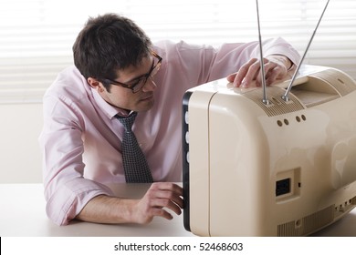 Businessman Watching A Stylish Retro TV