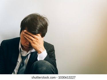 Businessman wear a stress-strain suit after work.copy space. - Shutterstock ID 1030613227
