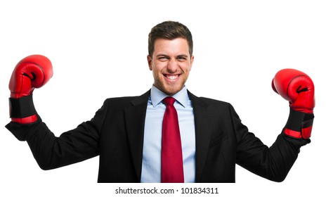 Businessman Wearing Boxing Gloves In A Victory Pose