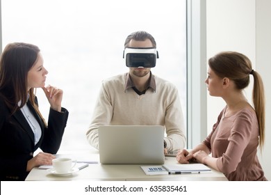 Businessman Wearing Innovative Vr Headset For Laptop At Business Meeting. Business Team Developing Virtual Reality Applications, Future Realistic Technology On Computer For Business Concept