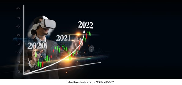 businessman wearing VR virtual reality headset hand touching visual screen graphic graph chart diagram on dark background, investment financial, stock market, trading statistic, metaverse concept
