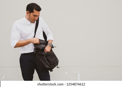Businessman Wearing White T Shirt With Blue Pant And Open The Bag On His Shoulder With Lifestyle Trendy Modern Life, Process Vintage Color.