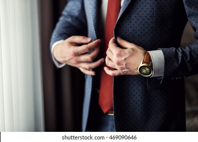 Businessman wears a jacket,male hands closeup,groom getting ready in the morning before wedding ceremony - Shutterstock ID 469090646