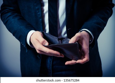 Businessman well-dressed with empty wallet