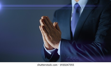 A businessman who joins hands and apologizes - Shutterstock ID 1920247355