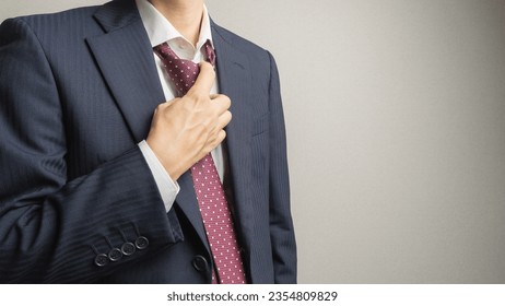 A businessman who loosens his tie. - Powered by Shutterstock