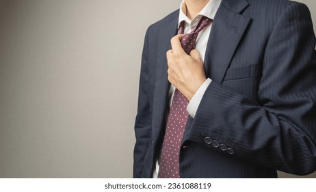 A businessman who loosens his tie. - Powered by Shutterstock