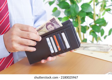 A Businessman Who Pays With A Bill That Says 