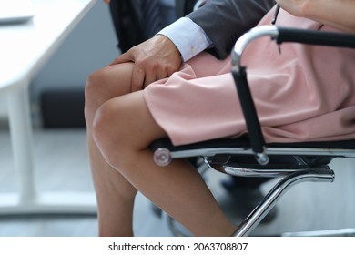 Businessman Will Put His Hand On Woman Leg Under Table Closeup