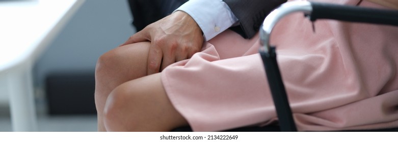 Businessman Will Put His Hand On Woman Leg Under Table Closeup