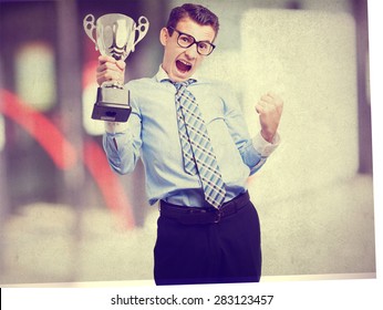 businessman with a winner cup