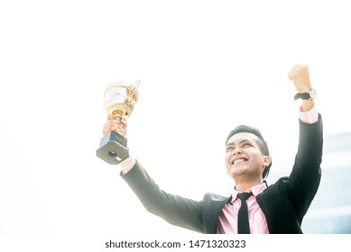 Businessman Wins A Trophy. Top Salesperson Concept