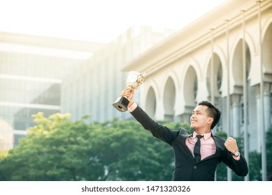 Businessman Wins A Trophy. Top Salesperson Concept