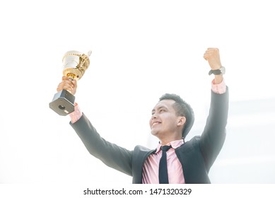 Businessman Wins A Trophy. Top Salesperson Concept