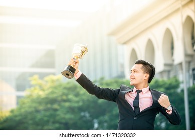 Businessman Wins A Trophy. Top Salesperson Concept