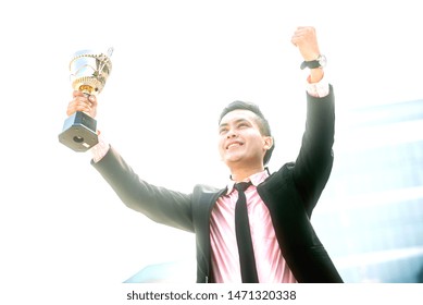 Businessman Wins A Trophy. Top Salesperson Concept