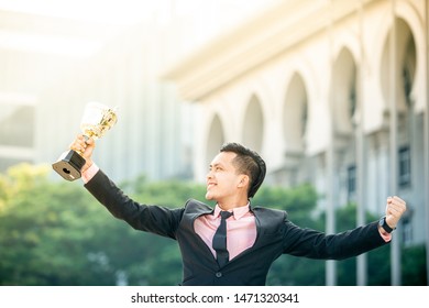 Businessman Wins A Trophy. Top Salesperson Concept