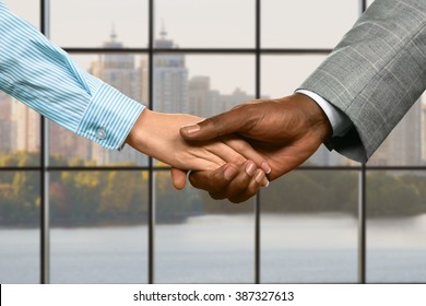 Businessman and woman office handshake. Business couple's handshake at midday. Giving a second chance. Appreciate what you have. - Shutterstock ID 387327613