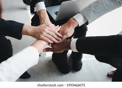 Businessman And Woman Putting Hands Join Together, Business Partnership Colleagues Holding Hands As Commitment Of Strong Team Work, Unity And Teamwork Join Hands Support Concept